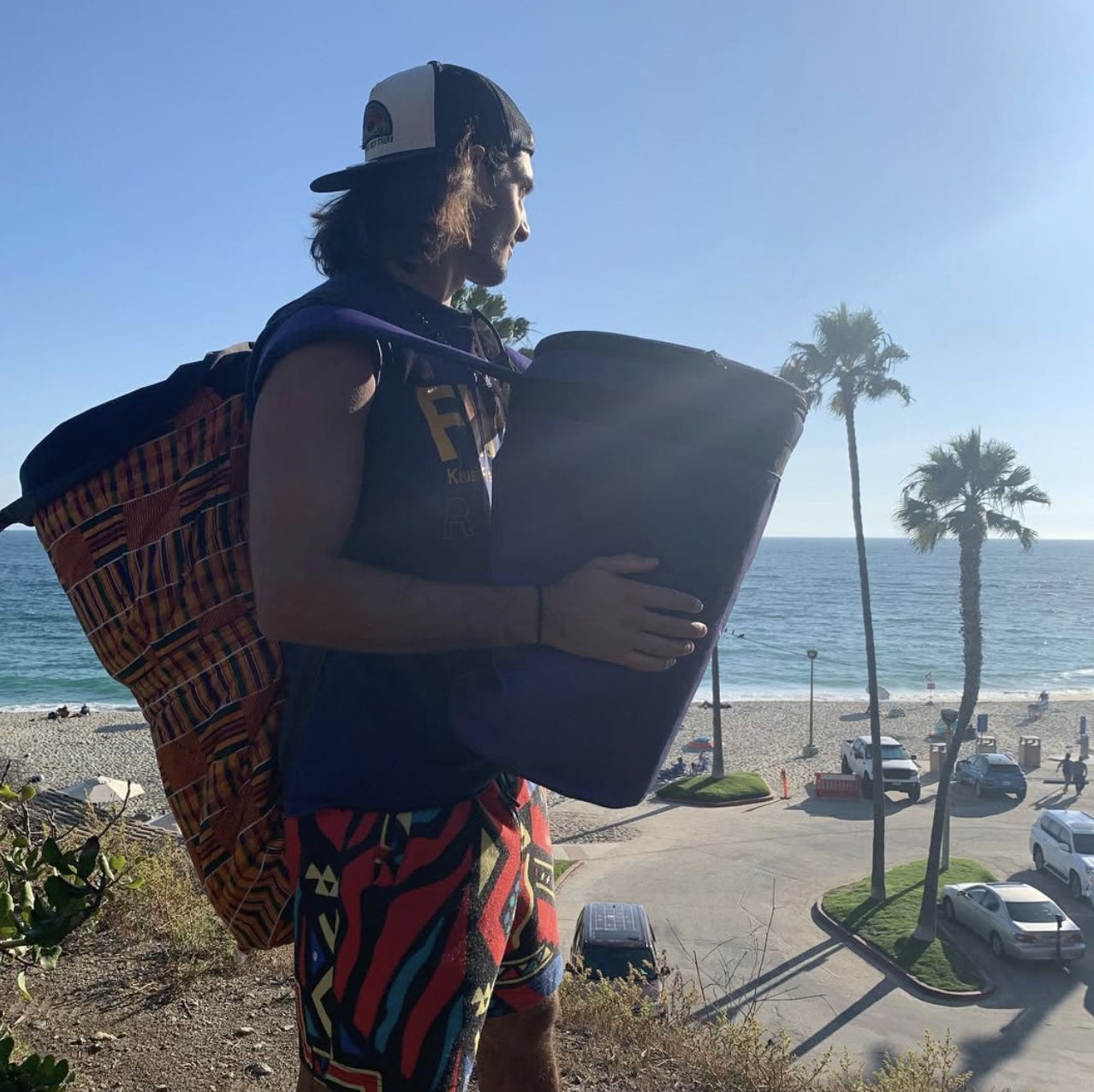 DJ Open House performing at beach event in Hawaii with live percussion